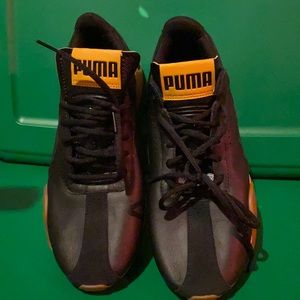 Black and White Pumas barely worn 9.5